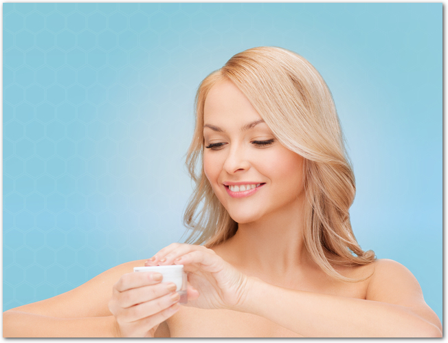 beautiful woman applying cream