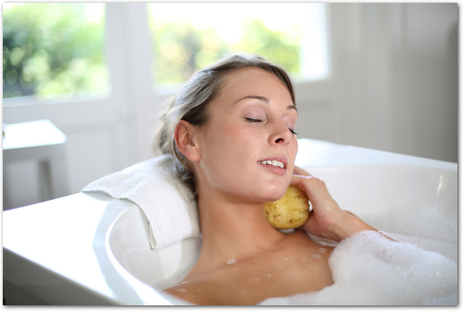Beautiful woman relaxing in baththub