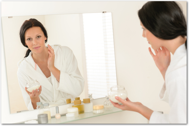 Woman facial mirror reflection in bathroom